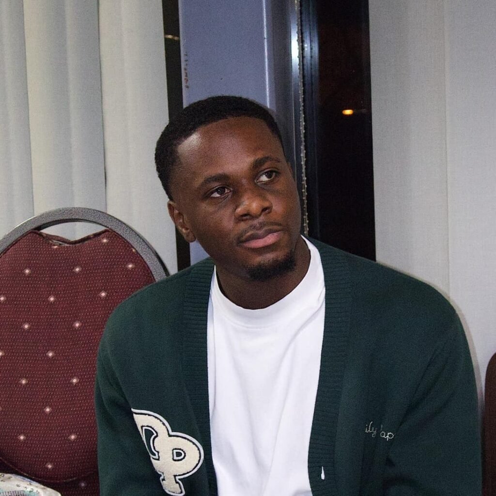 Moises Castelo thoughtfully looking off to the side during a gathering