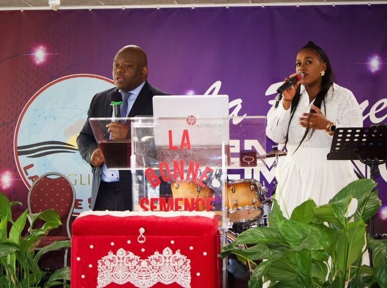 A preacher and a singer leading a service at Église La Bonne Semence.