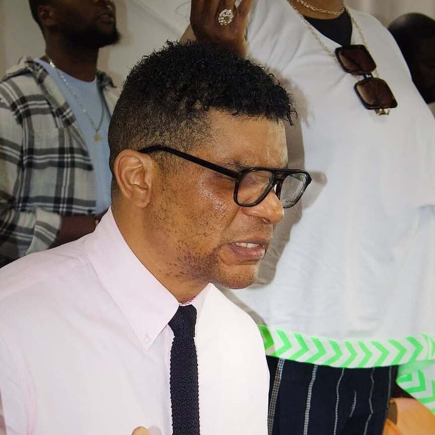 Close-up of Frère Alain emotionally engaged during a church service.