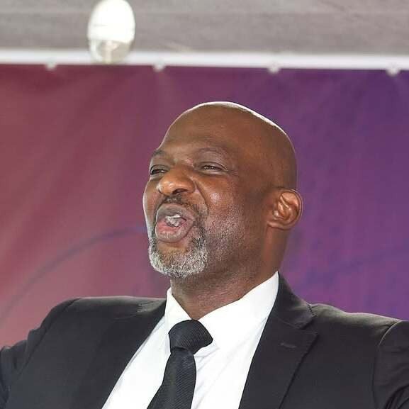 Frère Alain passionately speaking at an event.